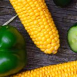 Produce - Three Yellow Corn Cobs, Bell Pepper, Cucumbers and Chili Peppers